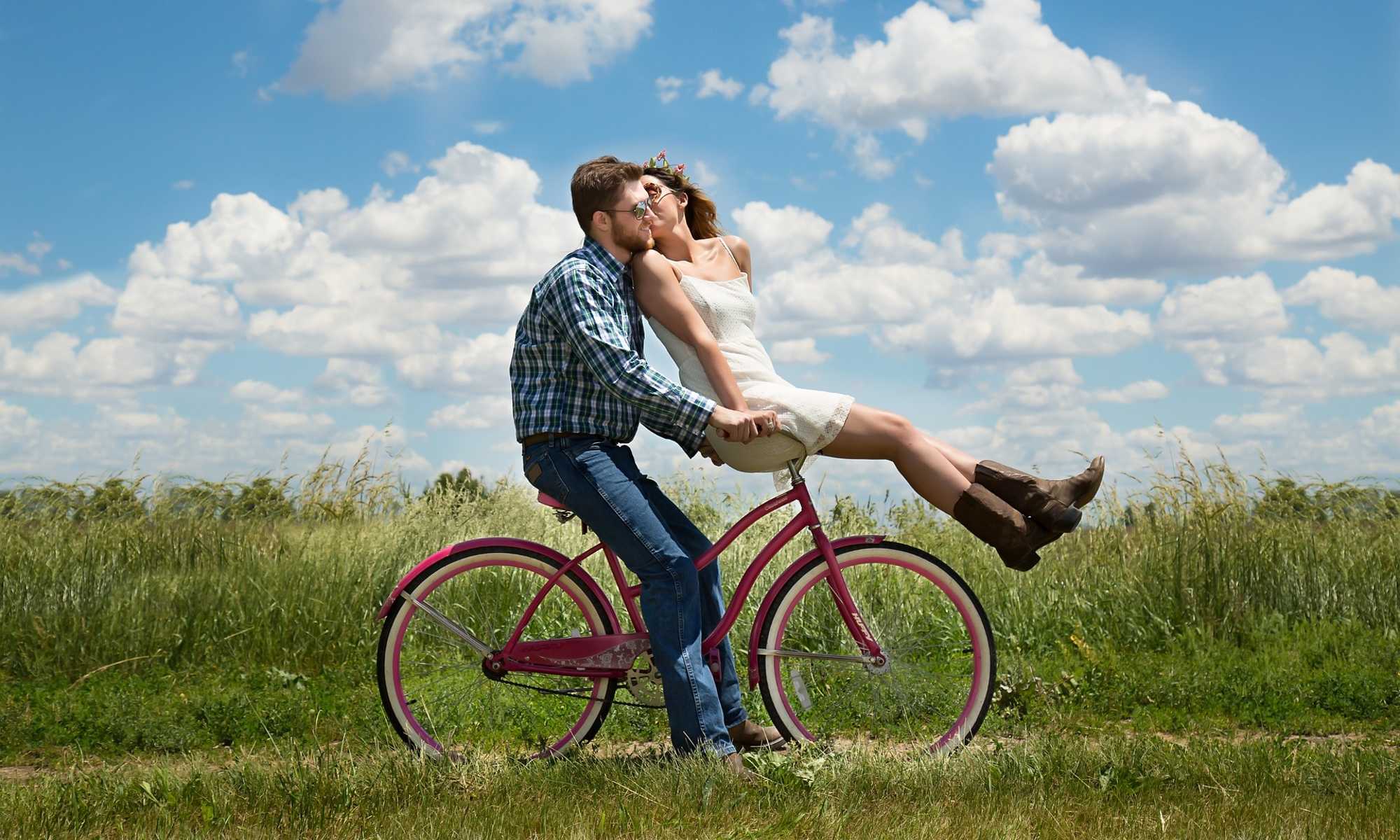 A couple riding a bike